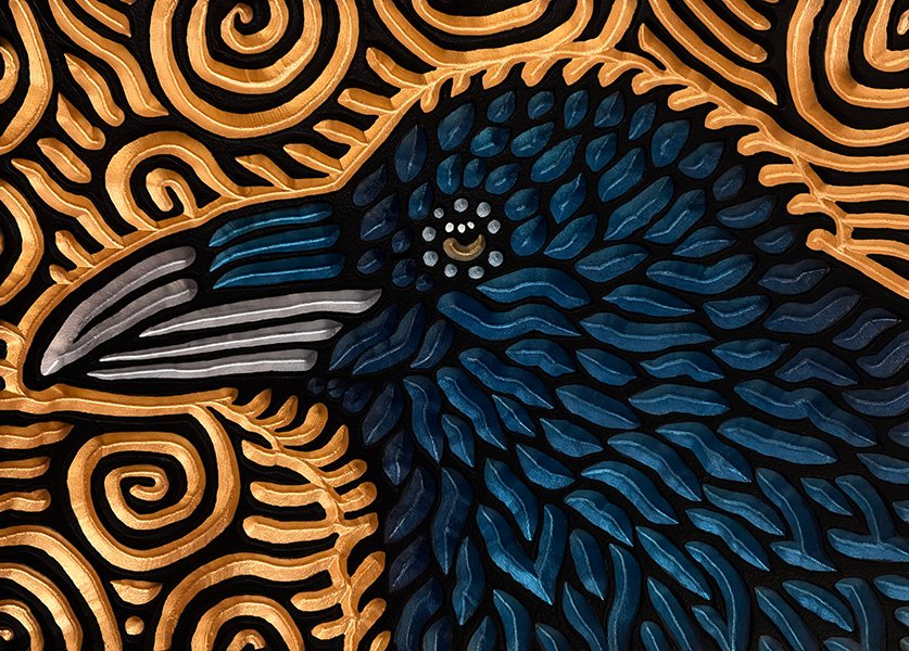 woodcarving of a raven in profile by Canadian artist Lisa Brawn
