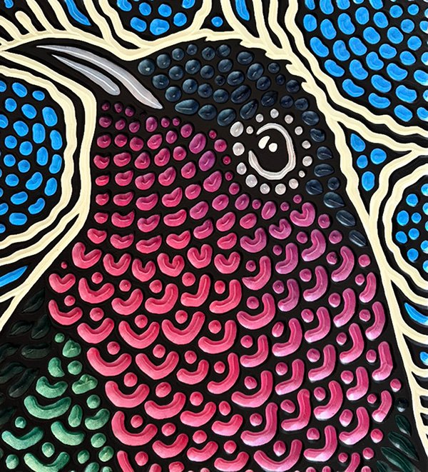 painted wood carving of a purple-throated Carib by Canadian artist Lisa Brawn