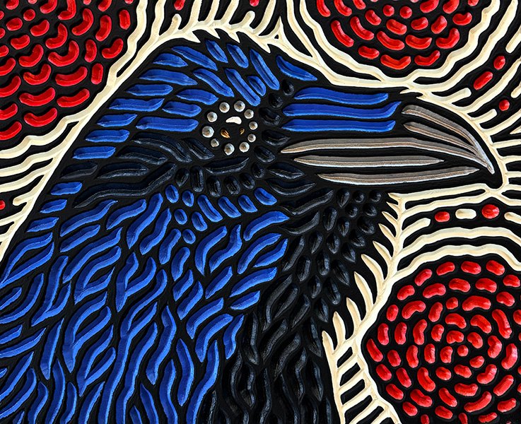 painted wood carving of a Raven by Canadian artist Lisa Brawn