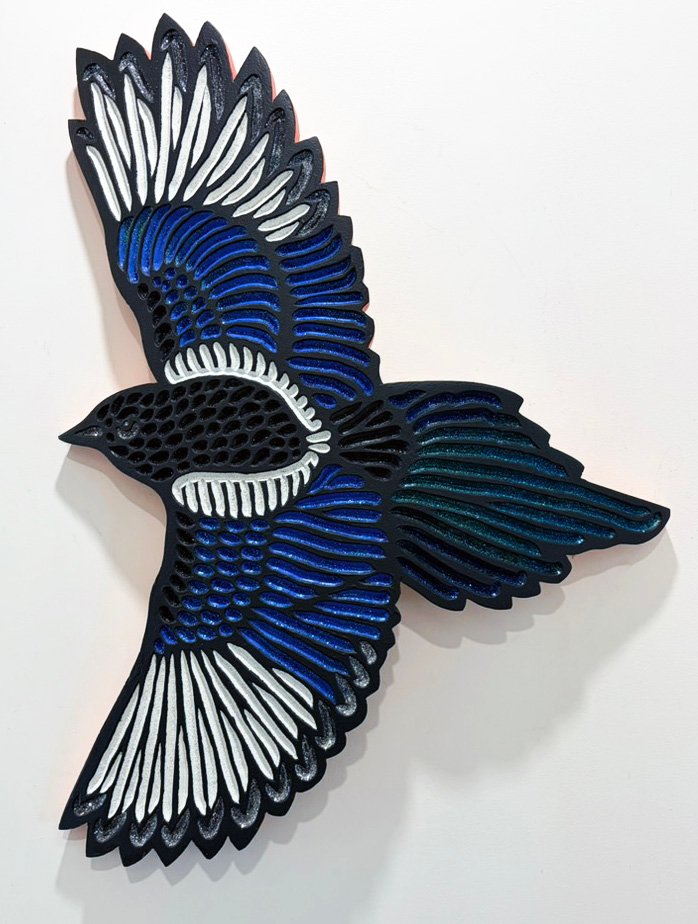 hand carved and painted Magpie in flight on curved oak by Canadian artist Lisa Brawn