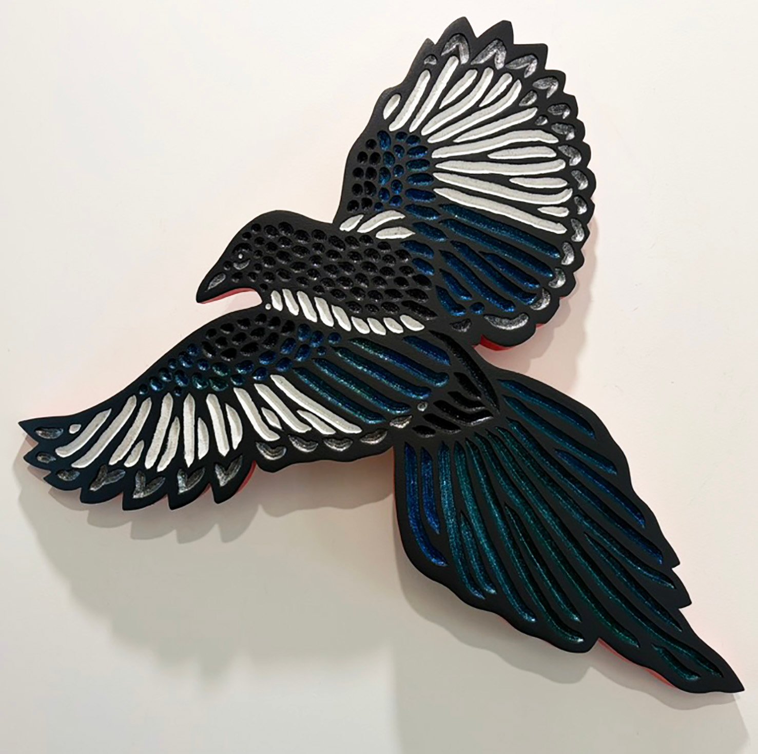 Magpie in flight hand carved and painted by Canadian artist Lisa Brawn